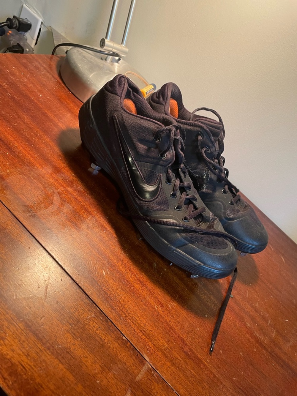 Nike Men’s Black Athletic Cleats with Orange Lining